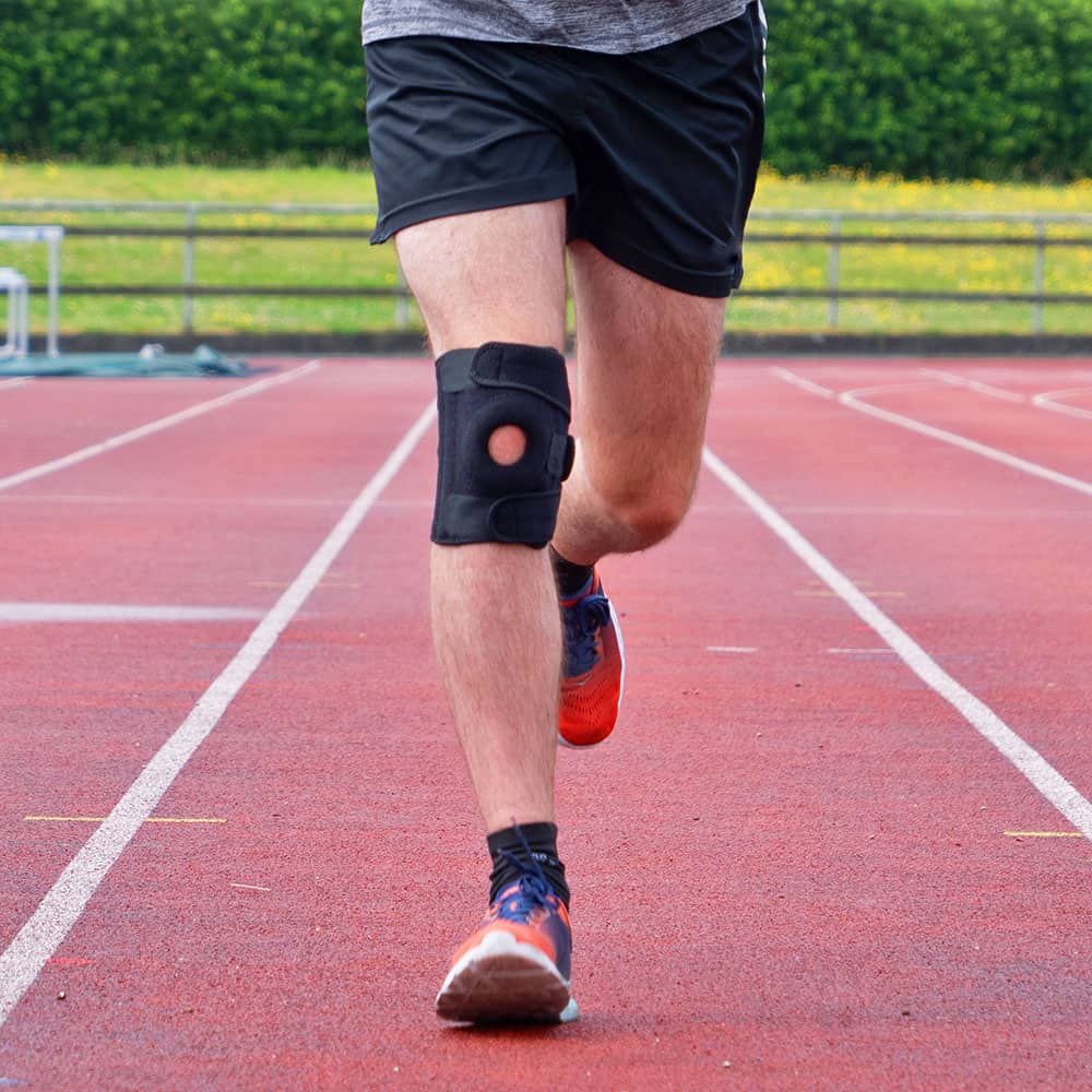 justerbart knäskydd för löpning